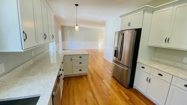 2 Touraine Street Worcester, MA 01604 - Photo 8 of 34 a kitchen with stainless steel appliances a refrigerator and a stove