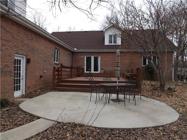 263 Bentridge Road Manchester, TN 37355 - Photo 3 of 6 The backyard is a paradise for leisure or entertaining featuring a concrete patio, deck, above ground pool and pool house.