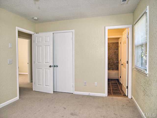 308 Sawmill Road Raleigh, NC 27615 - Photo 11 of 15 a view of an empty room with a window