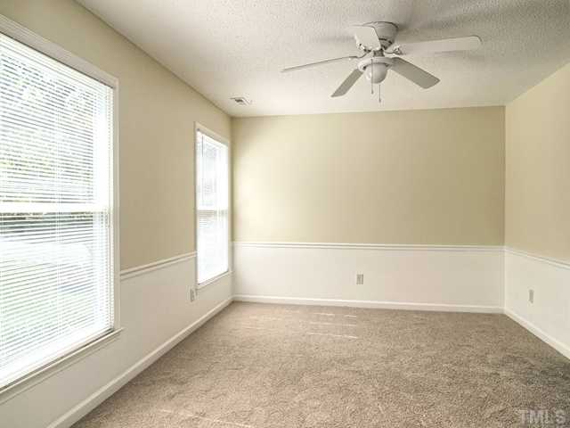 308 Sawmill Road Raleigh, NC 27615 - Photo 3 of 15 a view of an empty room with a window