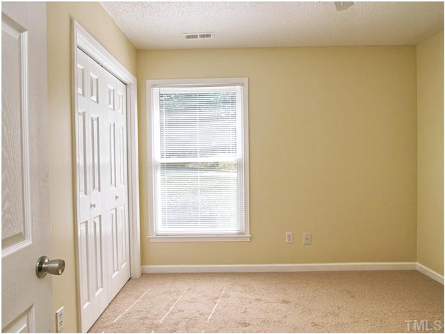 308 Sawmill Road Raleigh, NC 27615 - Photo 8 of 15 an empty room with windows