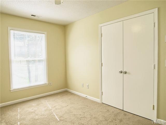 308 Sawmill Road Raleigh, NC 27615 - Photo 9 of 15 a view of an empty room with a window