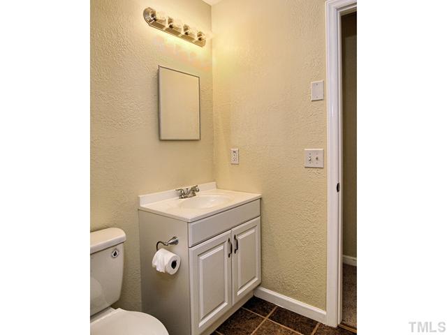 308 Sawmill Road Raleigh, NC 27615 - Photo 10 of 15 a bathroom with a sink a toilet and mirror