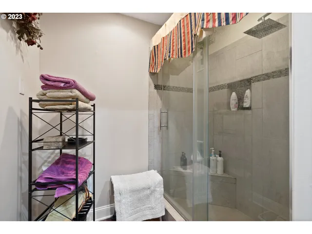 a bathroom with a sink mirror and vanity