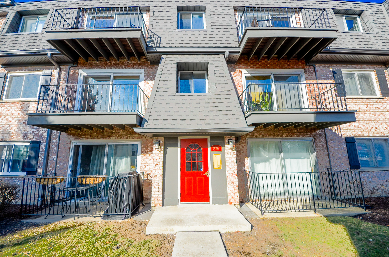 876 South Plum Grove Road, Unit 208 Palatine, IL 60067 - Photo 1 of 14 a front view of a house with large windows