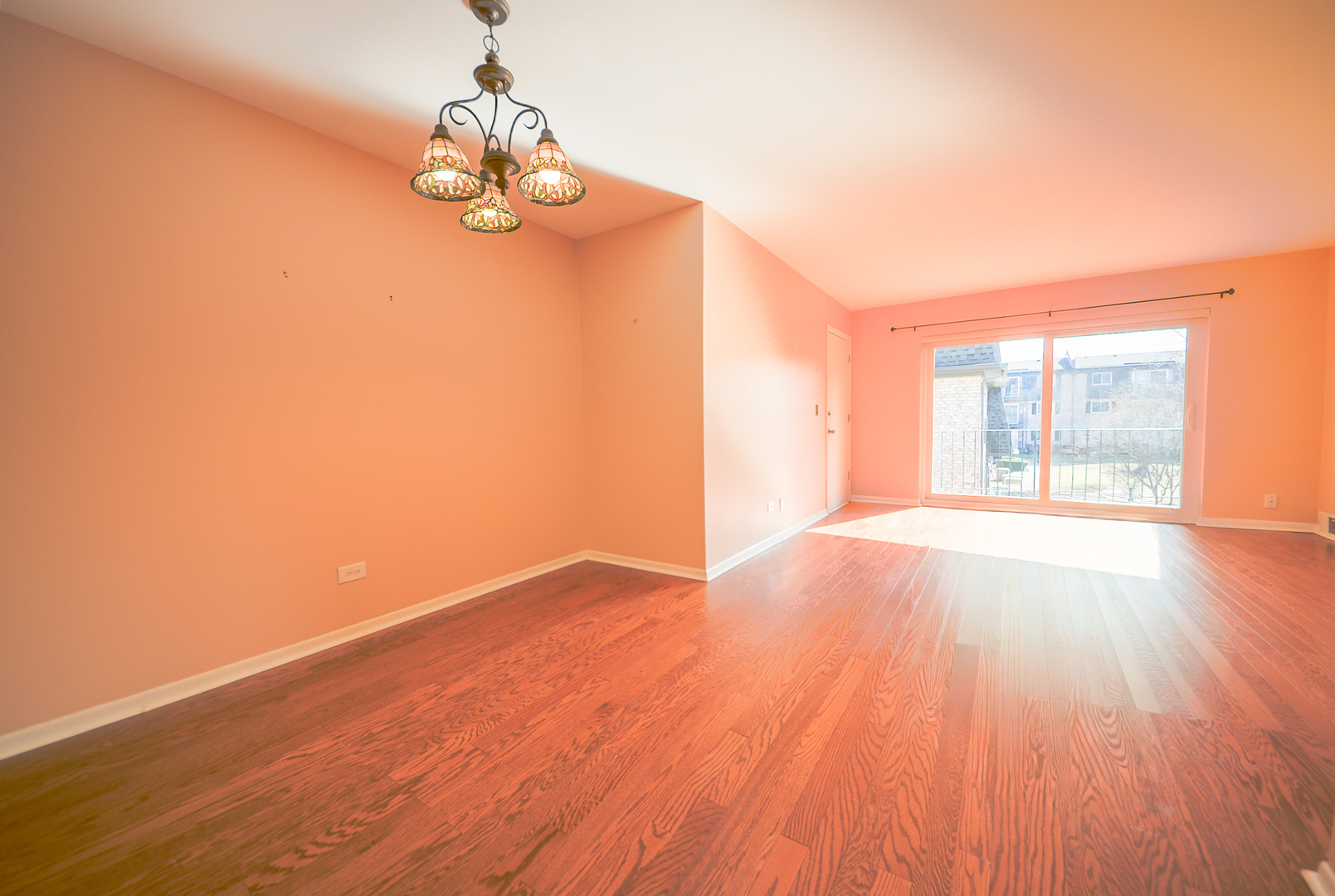 876 South Plum Grove Road, Unit 208 Palatine, IL 60067 - Photo 3 of 14 a view of empty room with wooden floor and fan