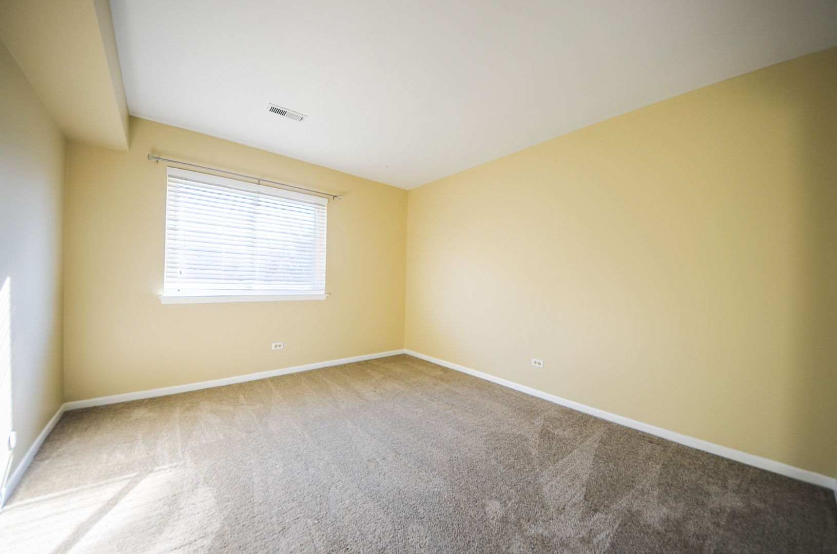876 South Plum Grove Road, Unit 208 Palatine, IL 60067 - Photo 8 of 14 an empty room with a window