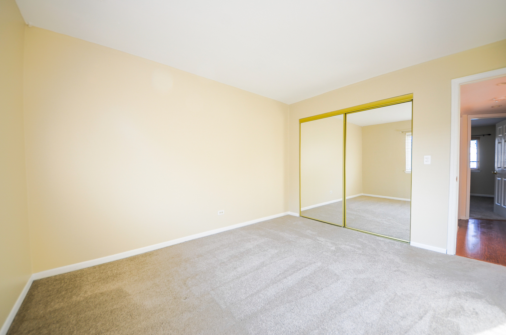 876 South Plum Grove Road, Unit 208 Palatine, IL 60067 - Photo 9 of 14 an empty room with a natural light