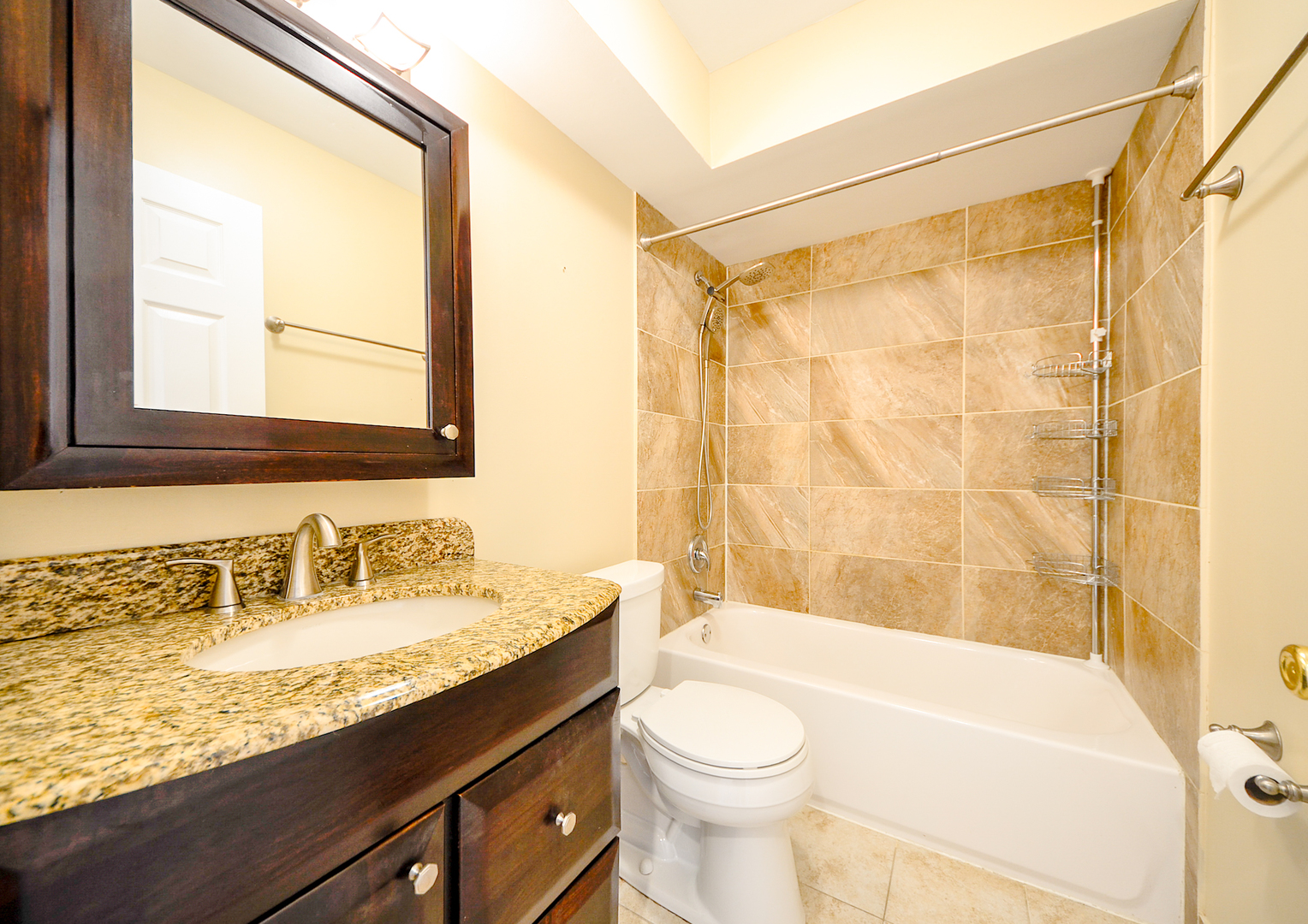 876 South Plum Grove Road, Unit 208 Palatine, IL 60067 - Photo 10 of 14 a bathroom with a granite countertop sink toilet and shower