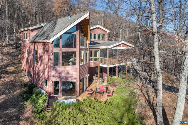 an aerial view of a house with a yard and potted plants