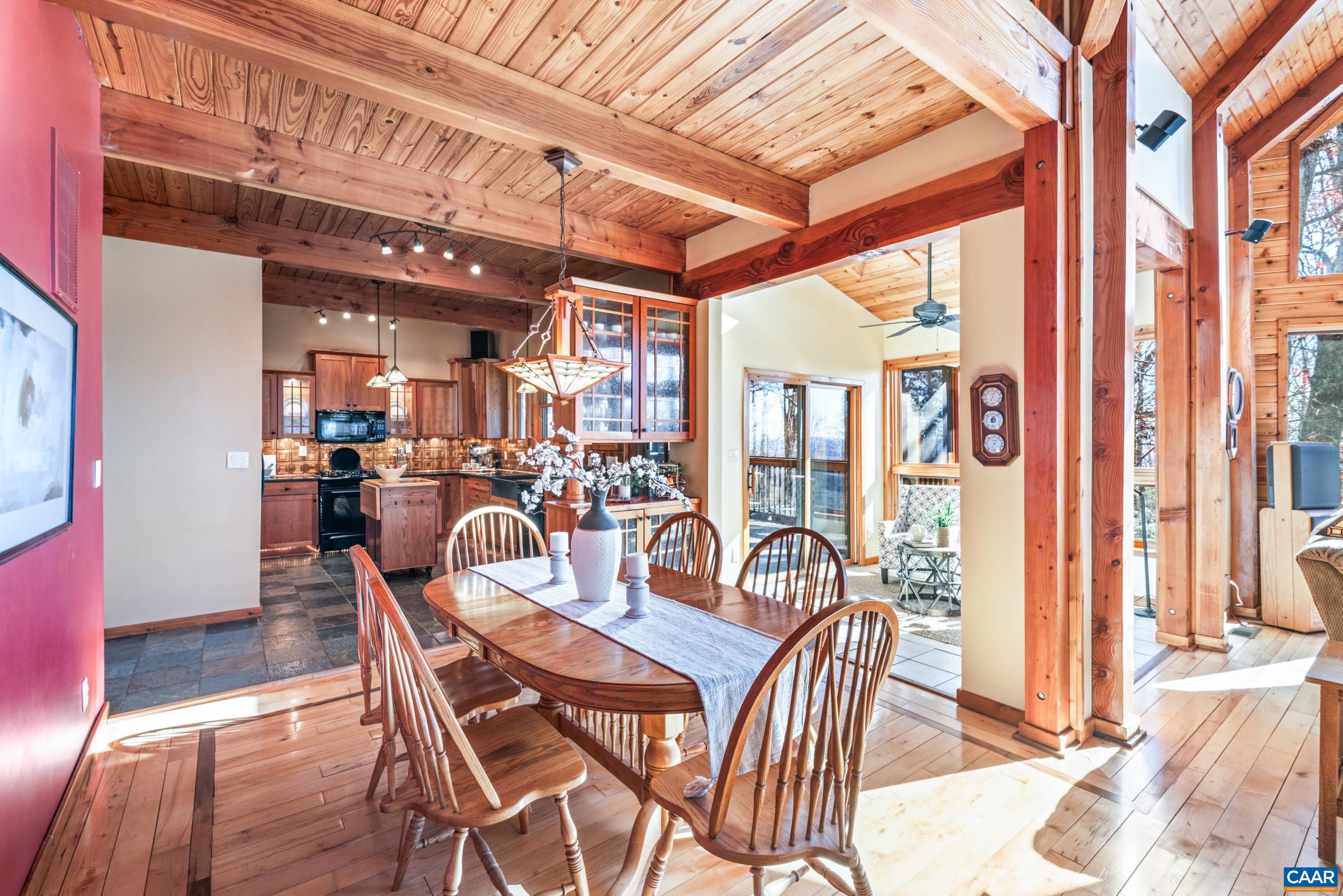 6696 Highlander Way Crozet, VA 22932 - Photo 12 of 71 a dining room with furniture and large windows