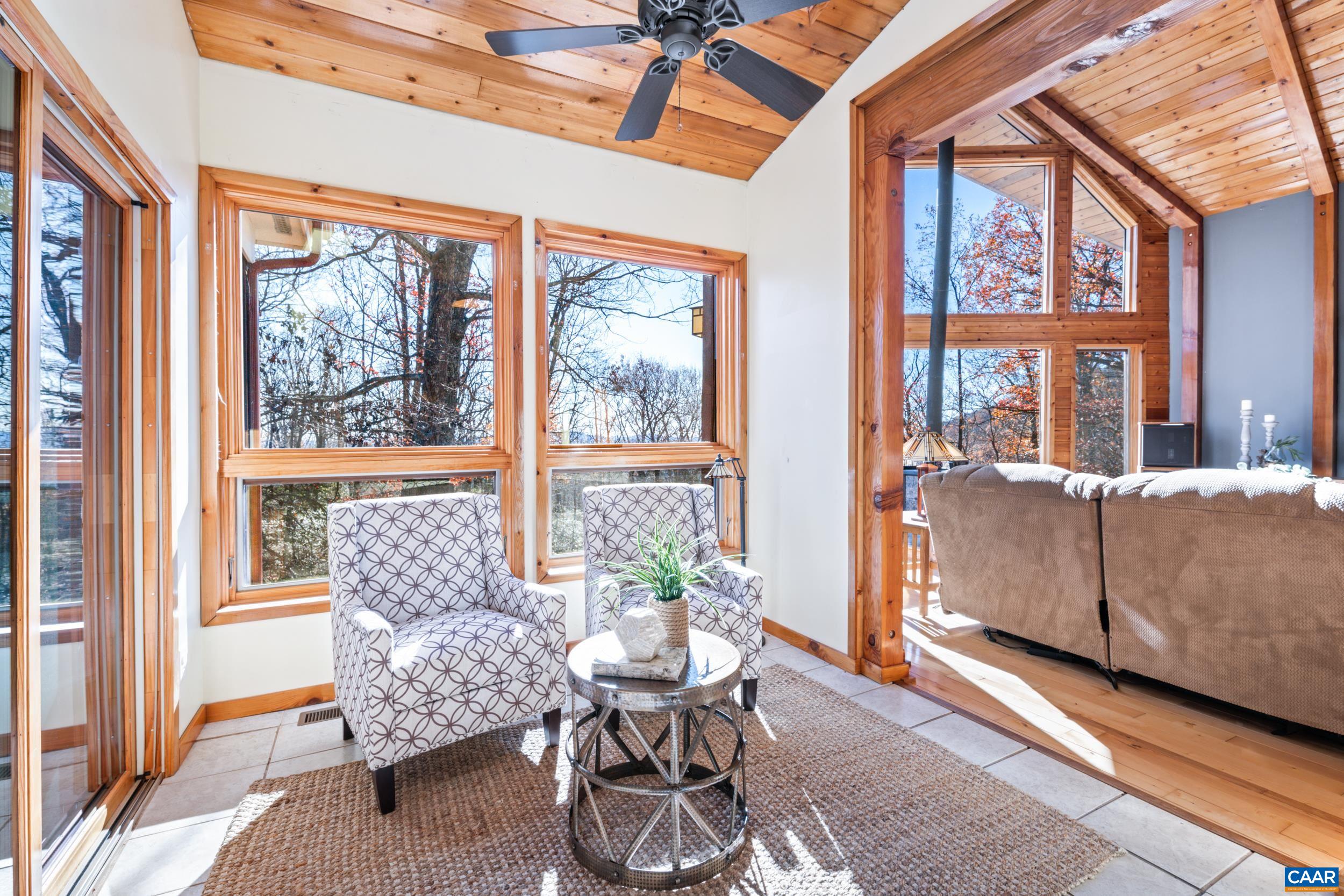 6696 Highlander Way Crozet, VA 22932 - Photo 13 of 71 a living room with furniture and a large window