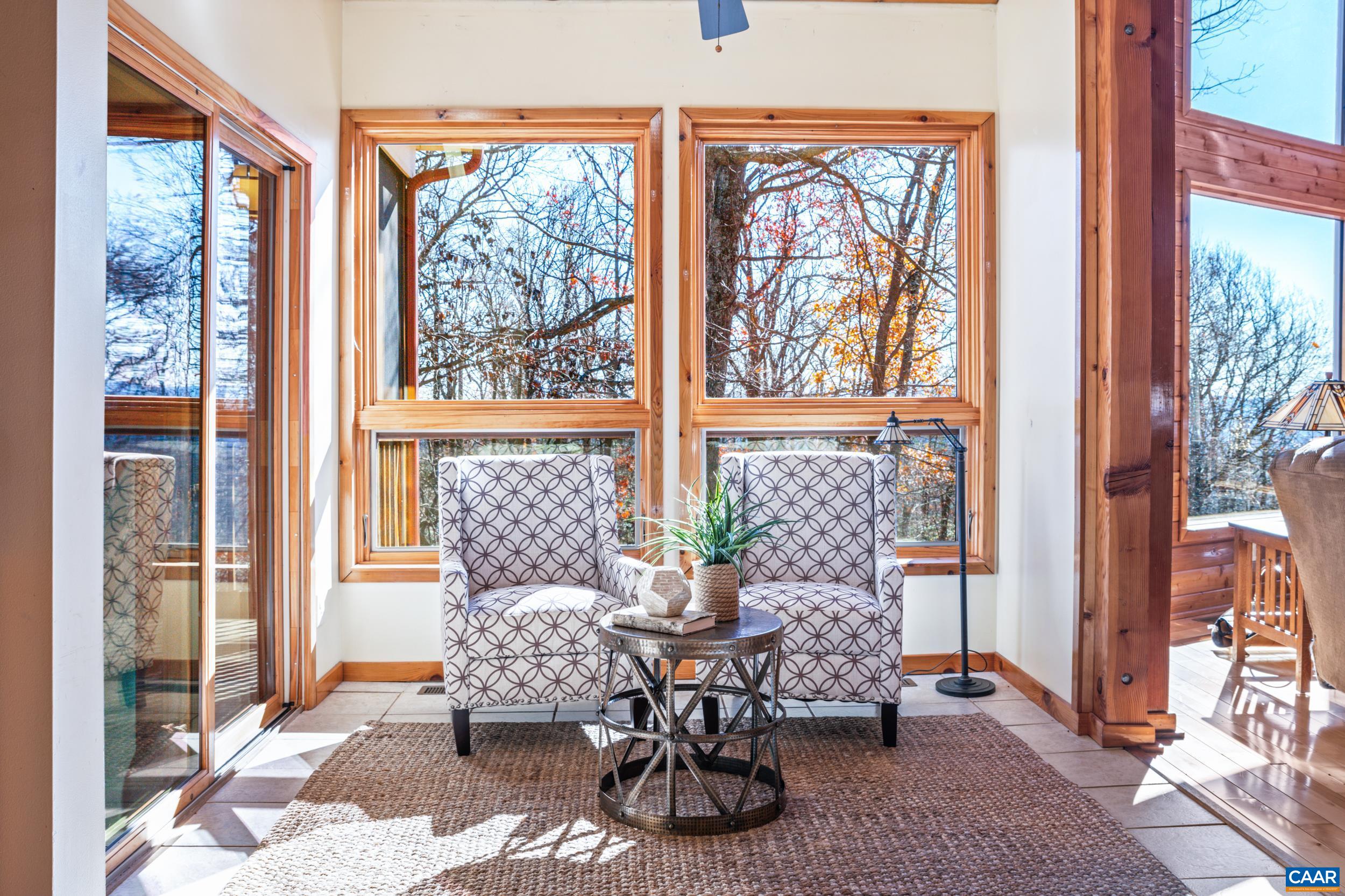 6696 Highlander Way Crozet, VA 22932 - Photo 14 of 71 a dining room with furniture and large windows