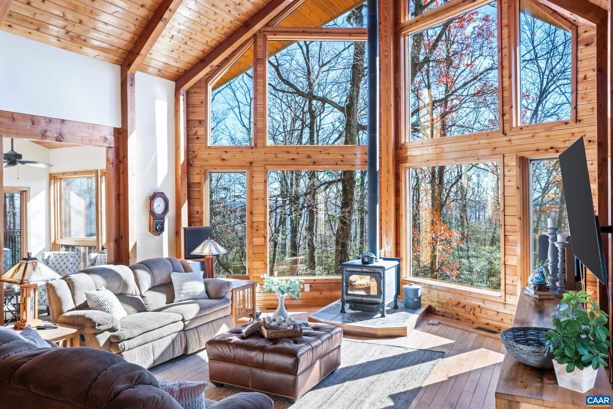 6696 Highlander Way Crozet, VA 22932 - Photo 18 of 71 a living room with furniture and large windows