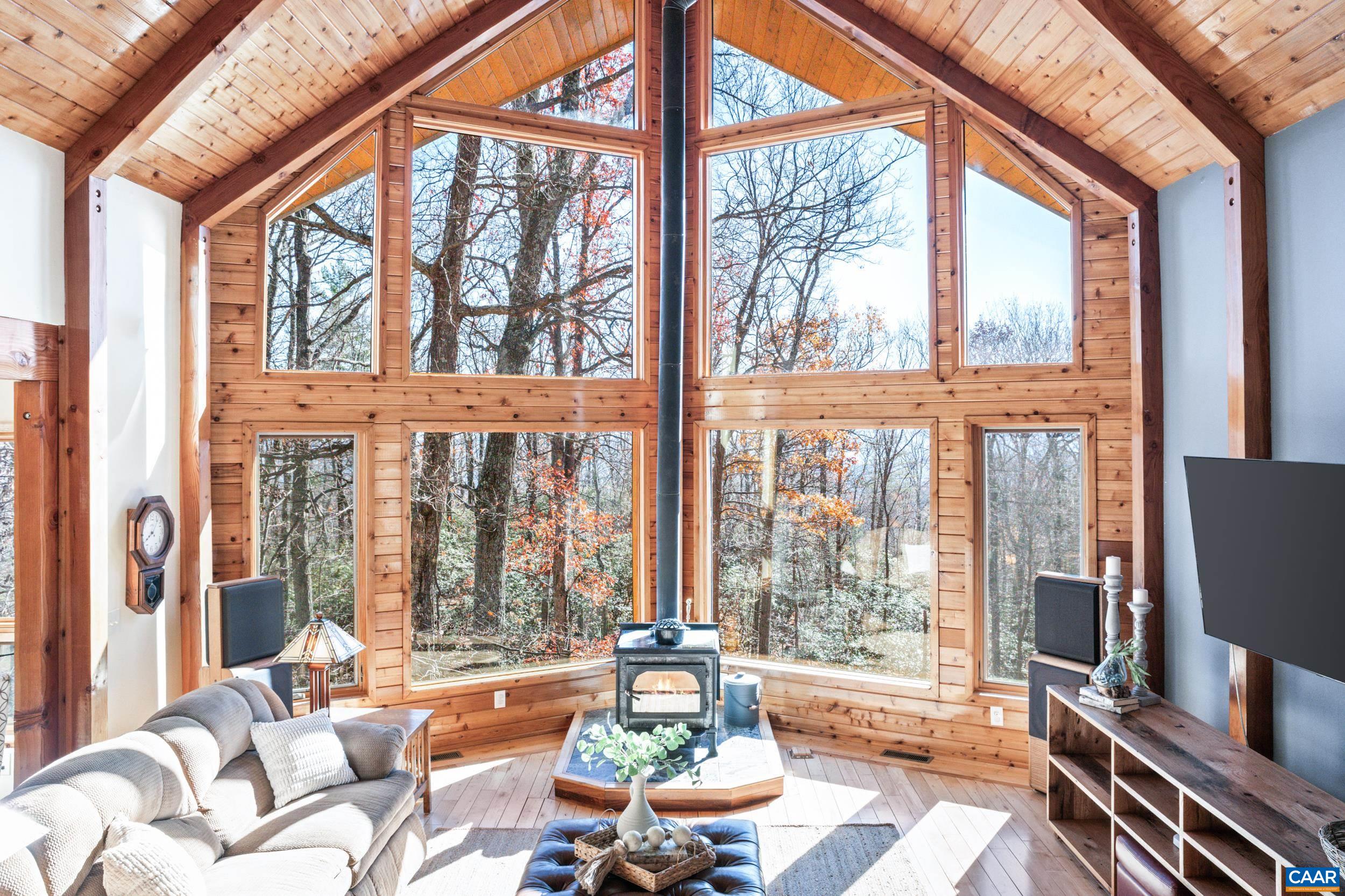6696 Highlander Way Crozet, VA 22932 - Photo 19 of 71 a living room with furniture and floor to ceiling windows