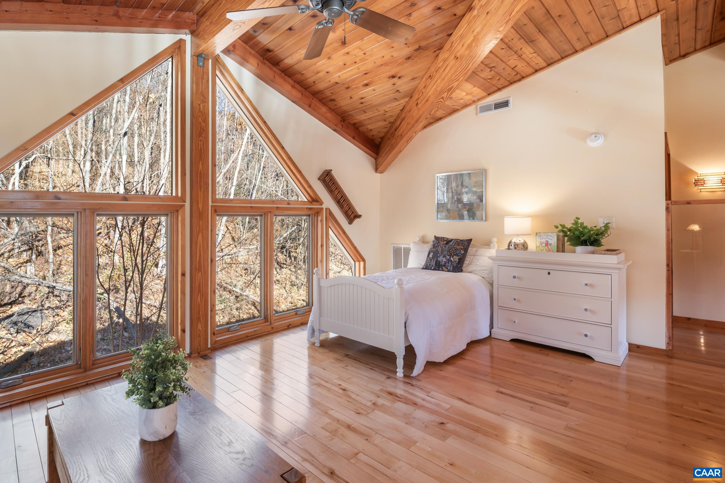 6696 Highlander Way Crozet, VA 22932 - Photo 33 of 71 a bedroom with furniture and wooden floor