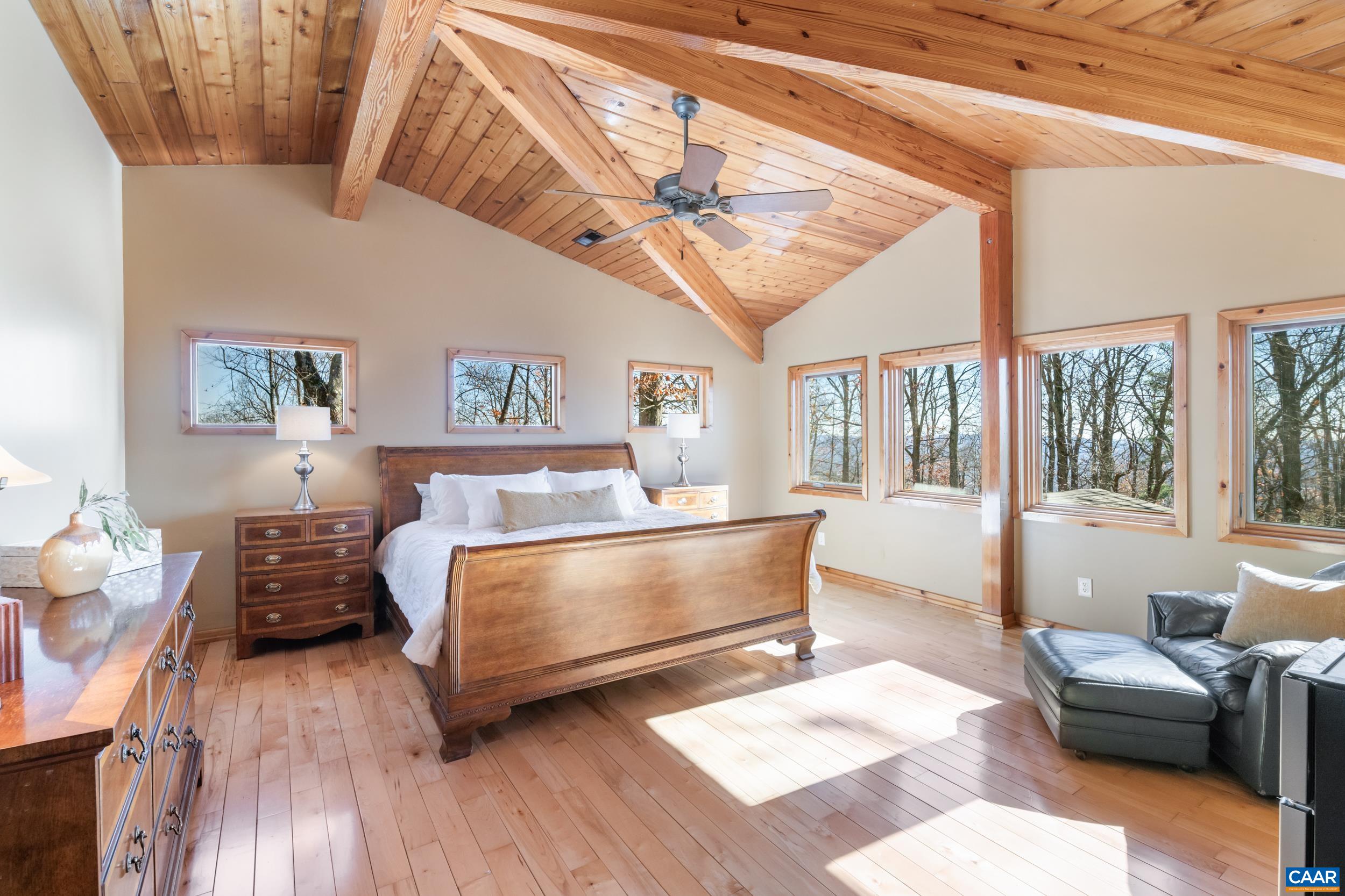 6696 Highlander Way Crozet, VA 22932 - Photo 34 of 71 a living room with furniture and a large window