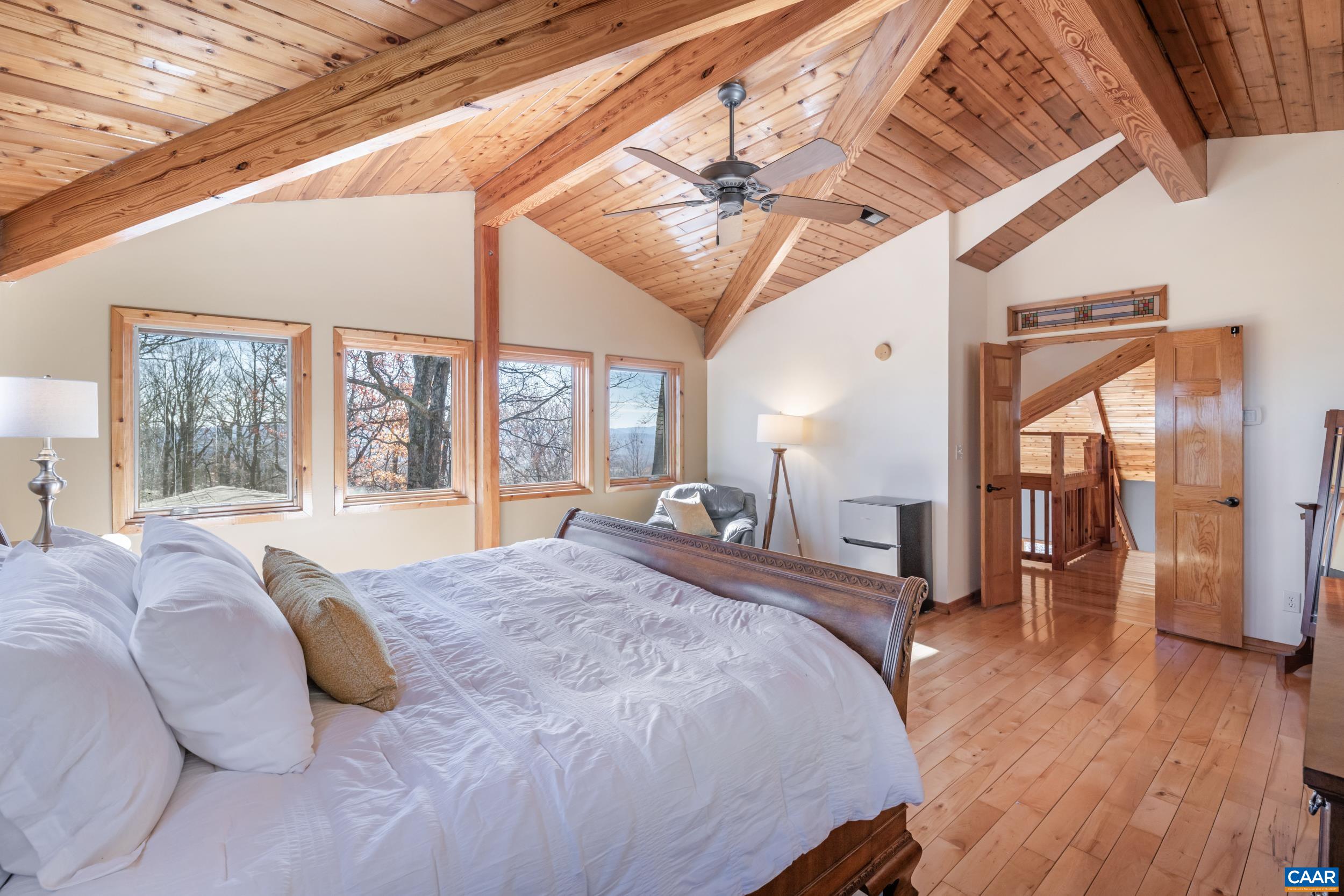 6696 Highlander Way Crozet, VA 22932 - Photo 35 of 71 a spacious bedroom with a large bed and a large window