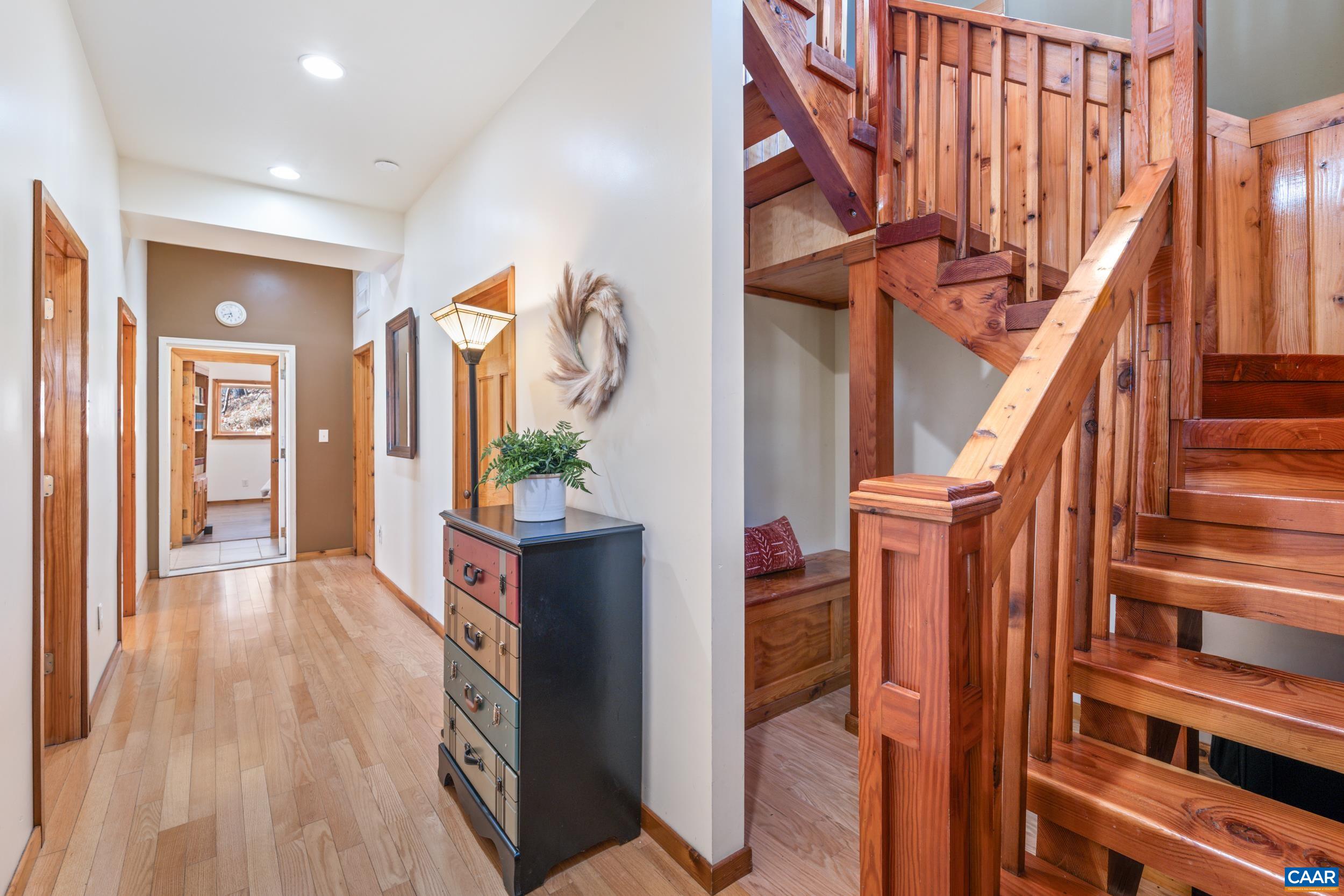 6696 Highlander Way Crozet, VA 22932 - Photo 42 of 71 a view of an entryway with wooden floor and stairs