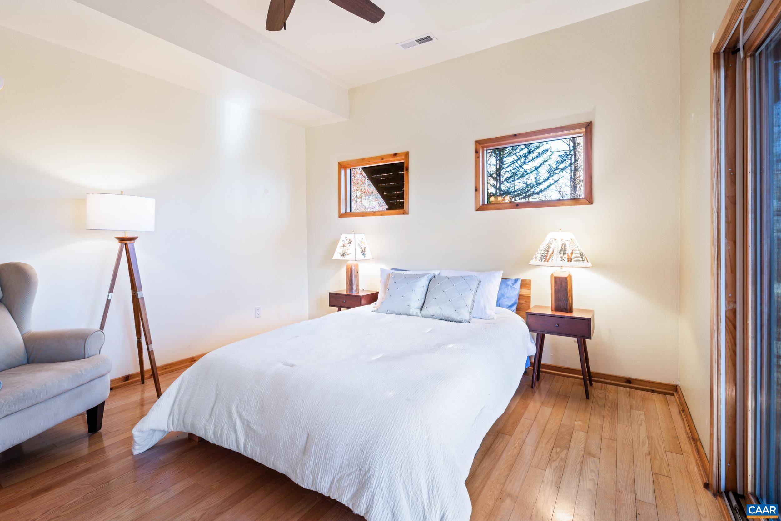 6696 Highlander Way Crozet, VA 22932 - Photo 44 of 71 a bedroom with a bed and a couch