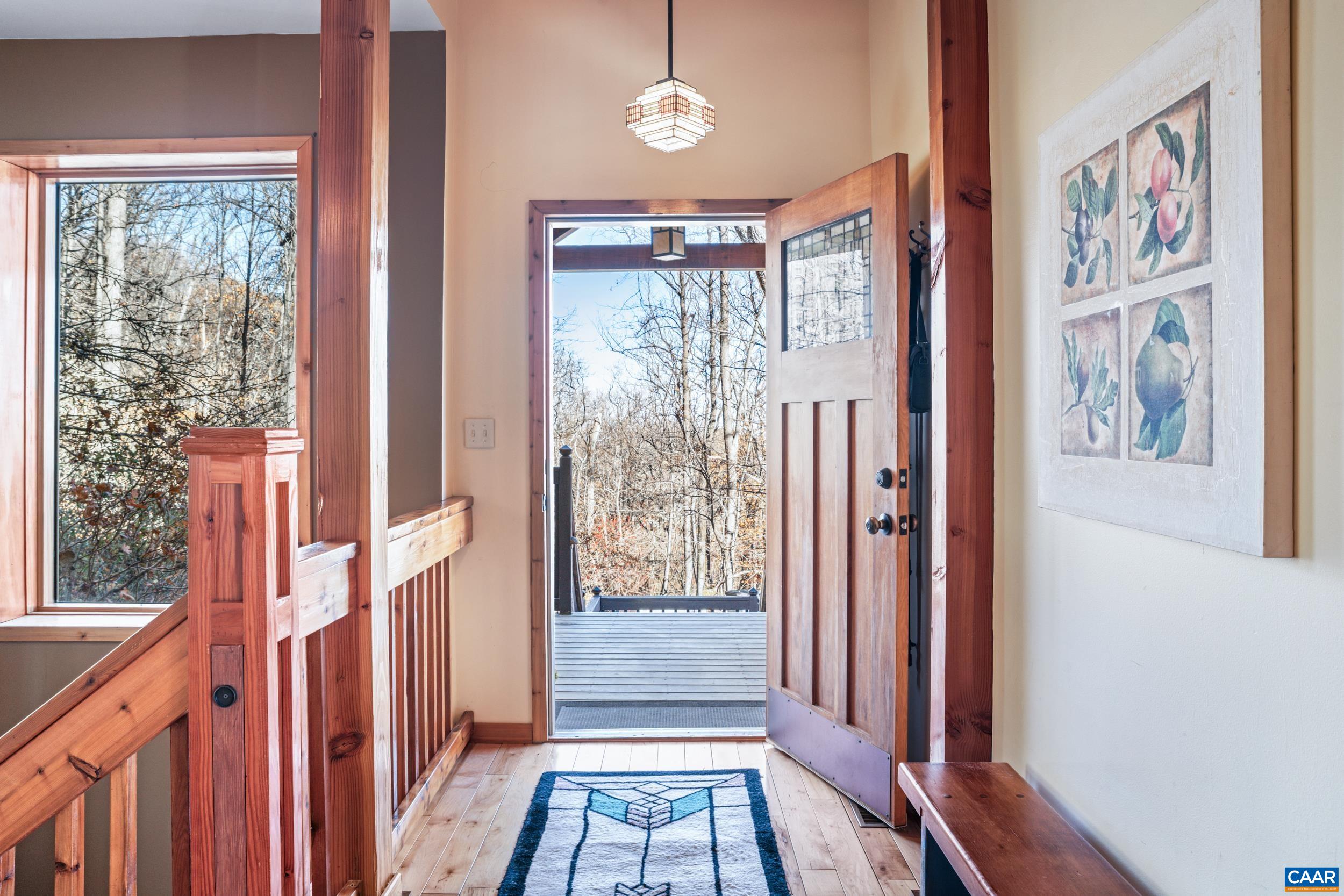 6696 Highlander Way Crozet, VA 22932 - Photo 5 of 71 a view of an entryway with wooden floor