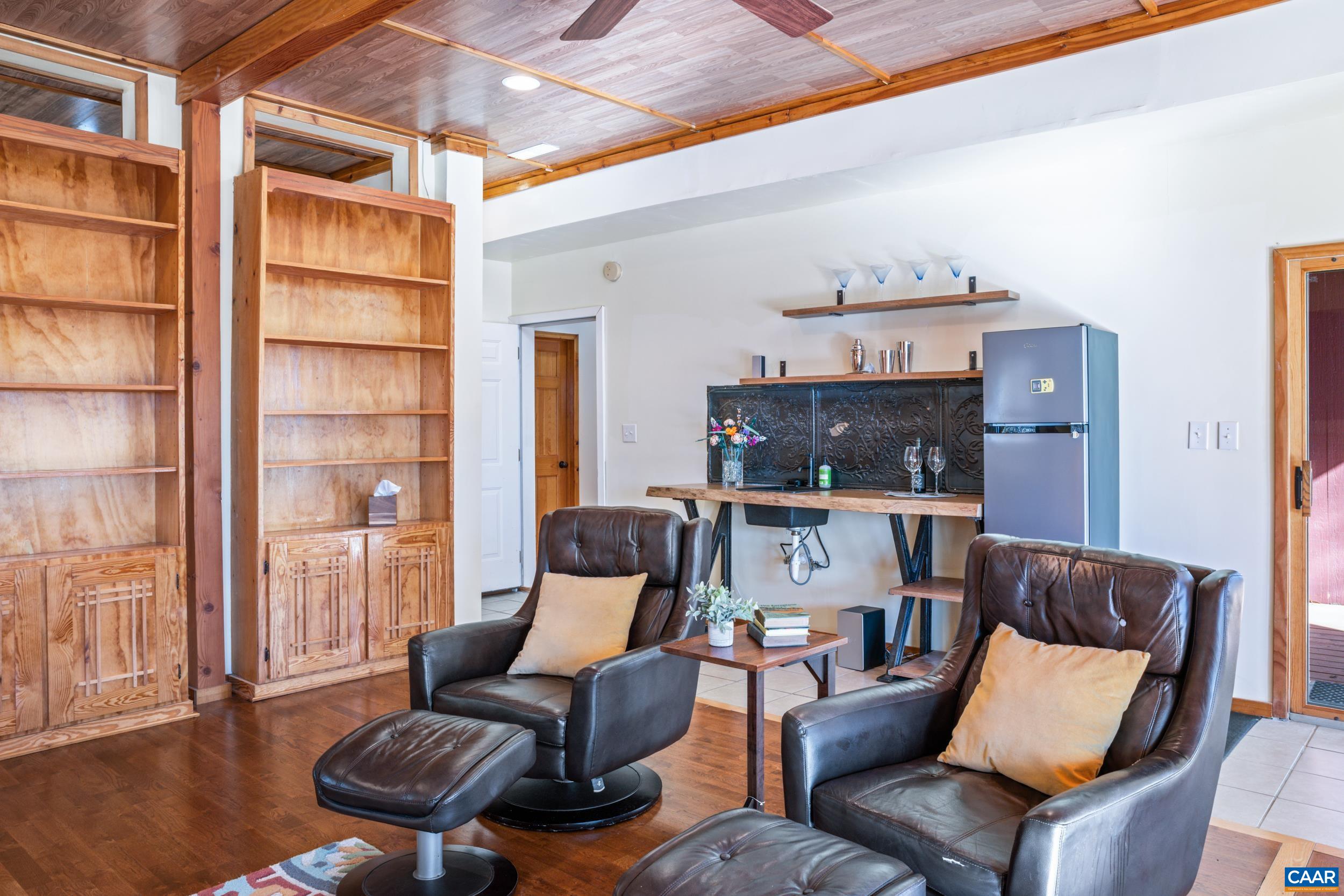 6696 Highlander Way Crozet, VA 22932 - Photo 52 of 71 a living room with furniture and wooden floor
