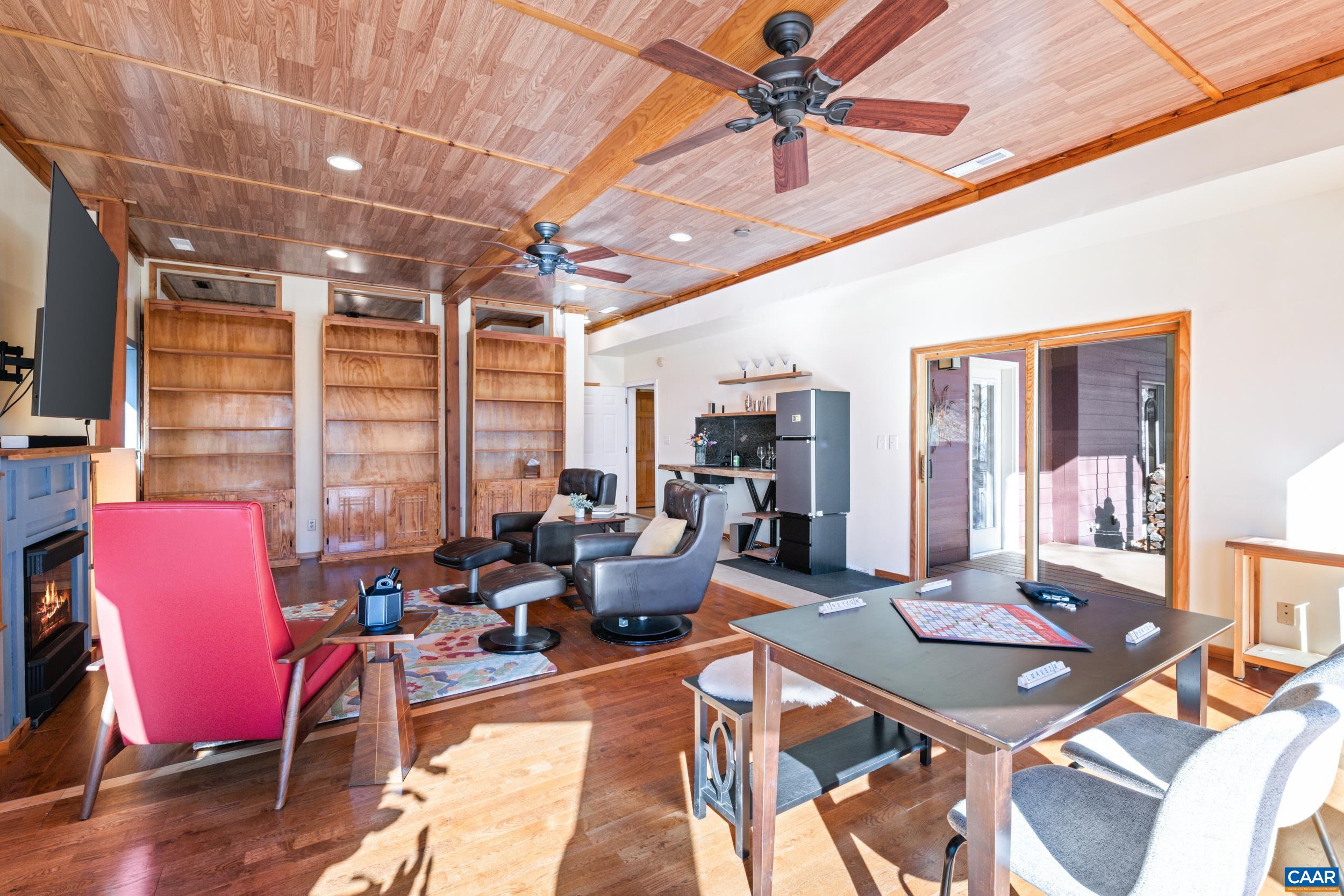 6696 Highlander Way Crozet, VA 22932 - Photo 53 of 71 a living room with furniture a table and chairs