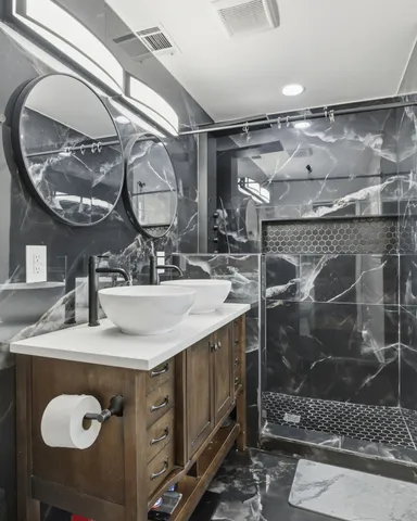 a large bed in a white bedroom