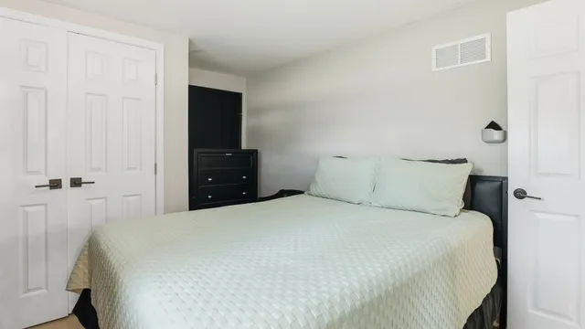 a bedroom with a workspace