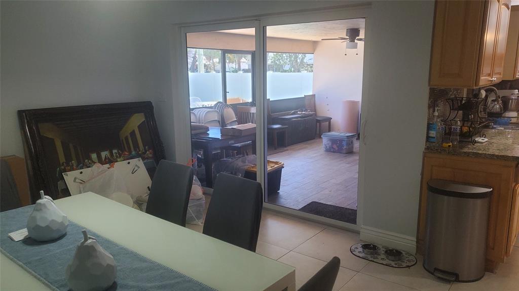 616 Southeast 8th Avenue Deerfield Beach, FL 33441 - Photo 13 of 38 a living room with furniture and a floor to ceiling window