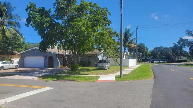a view of street with tall house