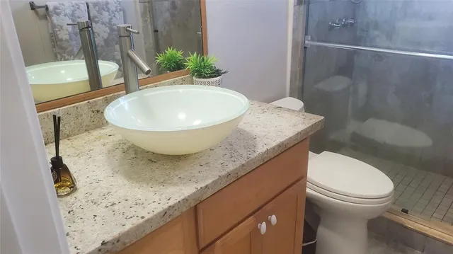 a bathroom with a sink and toilet