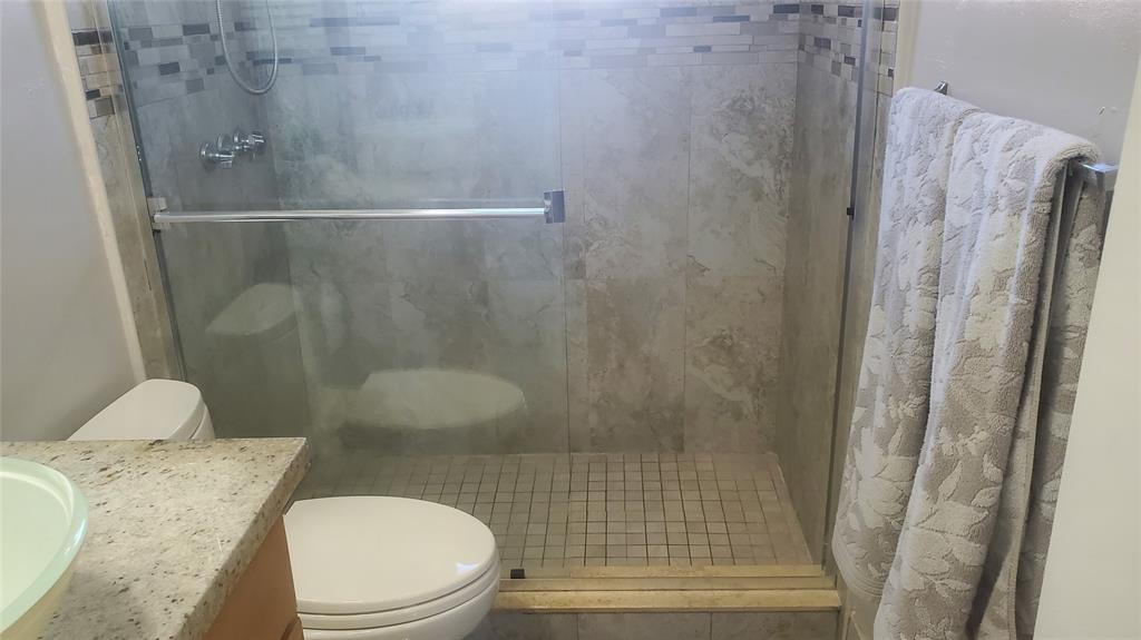 616 Southeast 8th Avenue Deerfield Beach, FL 33441 - Photo 22 of 38 a bathroom with a sink and toilet