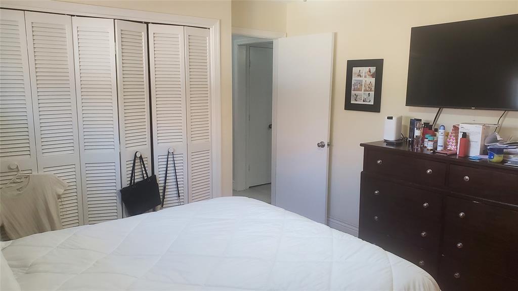 616 Southeast 8th Avenue Deerfield Beach, FL 33441 - Photo 24 of 38 a bedroom with a bed and a flat screen tv