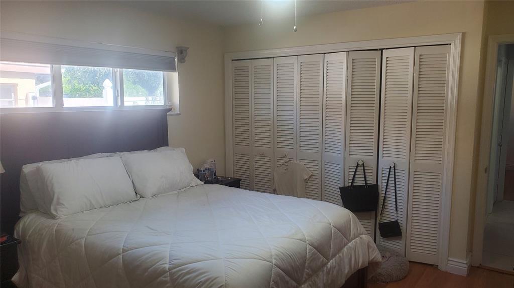 616 Southeast 8th Avenue Deerfield Beach, FL 33441 - Photo 25 of 38 a bedroom with a bed and a window