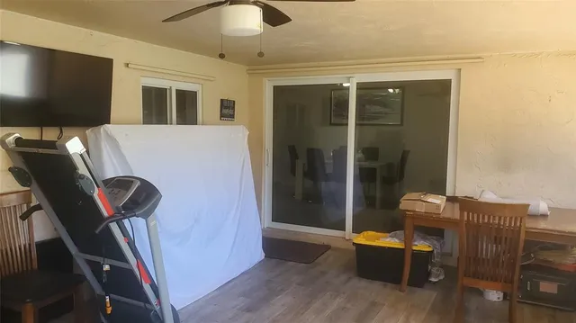 a view of a chairs and table in backyard