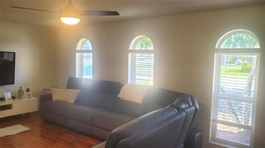 616 Southeast 8th Avenue Deerfield Beach, FL 33441 - Photo 4 of 38 a living room with furniture and a window