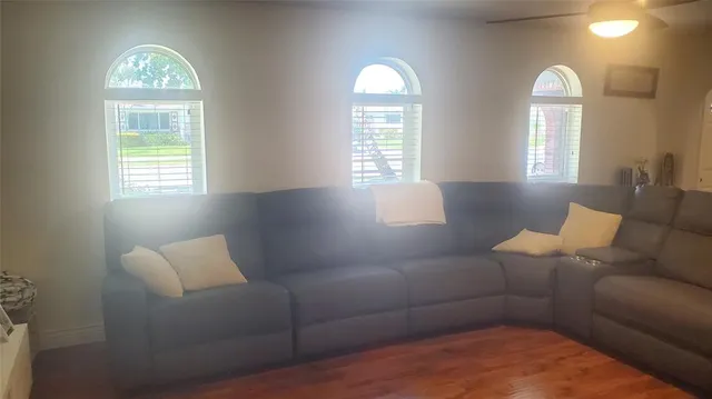 a living room with furniture and a window
