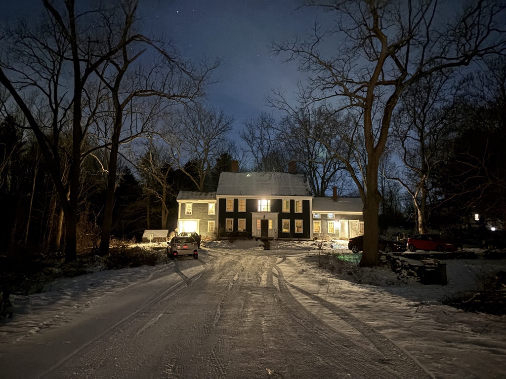 25 Bulkeley Road, Unit CENTER Littleton, MA 01460 - Photo 1 of 40 a view of a building with a large tree