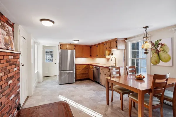 a kitchen with stainless steel appliances a refrigerator and a stove top oven