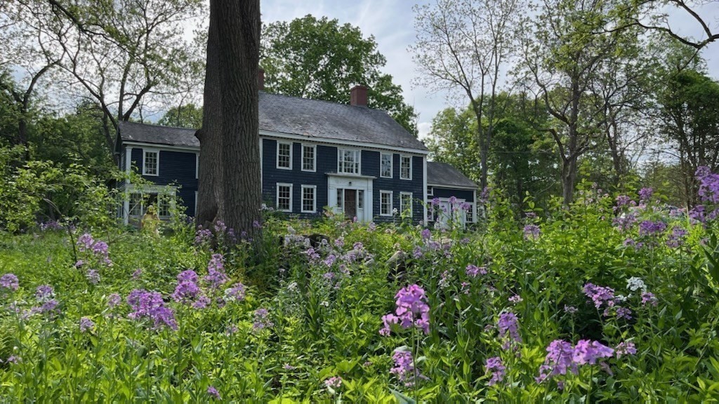 25 Bulkeley Road, Unit CENTER Littleton, MA 01460 - Photo 2 of 40 a view of a house with a flower garden