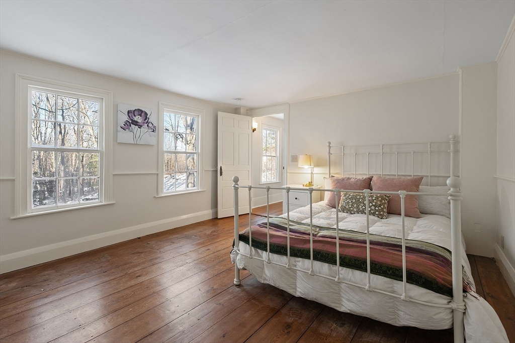 25 Bulkeley Road, Unit CENTER Littleton, MA 01460 - Photo 32 of 40 a bedroom with furniture and a window