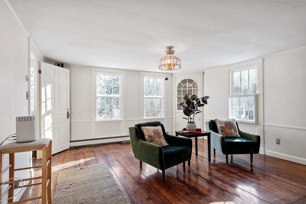 25 Bulkeley Road, Unit CENTER Littleton, MA 01460 - Photo 8 of 40 a living room with furniture and a window