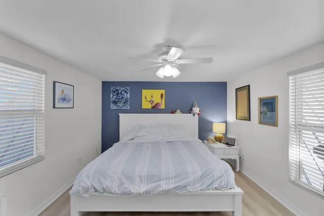 a bed room with a bed and a chandelier