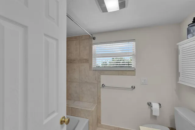 a bathroom with a bathtub and shower