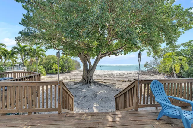 a view of a roof deck with wooden fence and floor