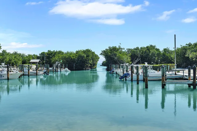 an outdoor sitting area with lake view