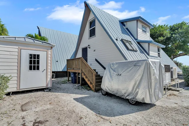 an aerial view of a house with a yard and garden