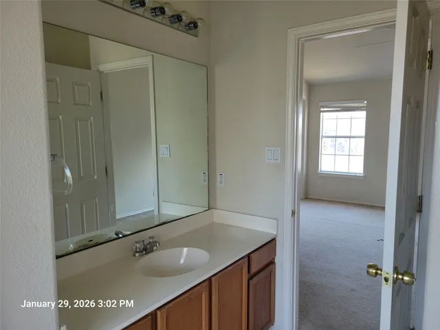 a bathroom with a bathtub and window