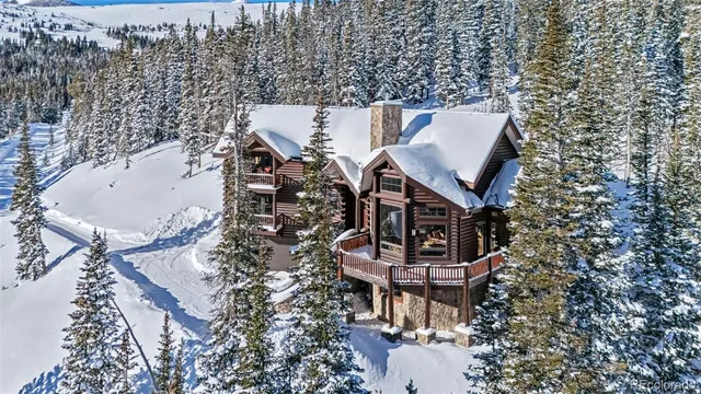 a view of a balcony with chair and city view